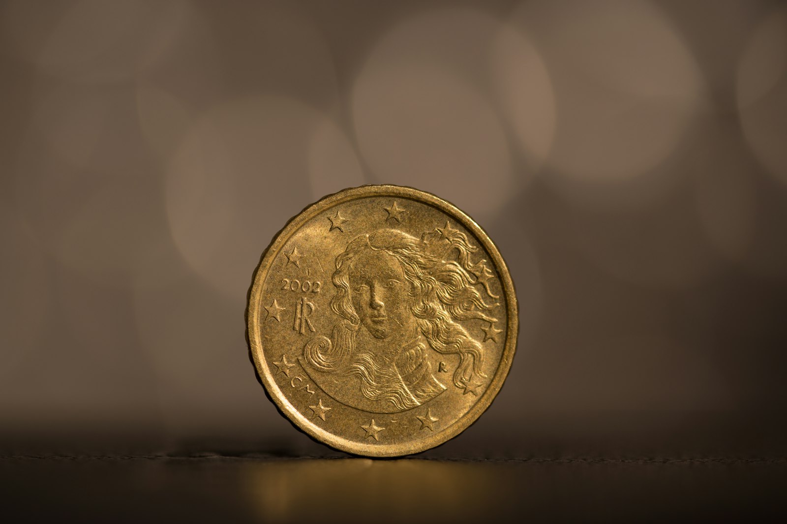 Close-up of a single gold coin